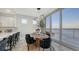 Elegant dining area with water views and seating for six at 611 Riviera Dunes Way # 702, Palmetto, FL 34221