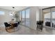 Bright dining room with water views and seating for six at 611 Riviera Dunes Way # 702, Palmetto, FL 34221