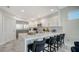 Modern kitchen with stainless steel appliances and white cabinets at 611 Riviera Dunes Way # 702, Palmetto, FL 34221