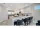 Modern kitchen island with seating for four at 611 Riviera Dunes Way # 702, Palmetto, FL 34221