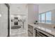 Modern kitchen with marble countertops and stainless steel appliances at 611 Riviera Dunes Way # 702, Palmetto, FL 34221