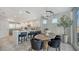 Modern kitchen with an island, stainless steel appliances, and breakfast bar at 611 Riviera Dunes Way # 702, Palmetto, FL 34221