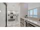 Open concept kitchen with breakfast bar and water views at 611 Riviera Dunes Way # 702, Palmetto, FL 34221