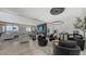 Bright living room featuring a large sectional sofa and water views at 611 Riviera Dunes Way # 702, Palmetto, FL 34221