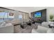 Spacious living room features a modern fireplace and stunning water views at 611 Riviera Dunes Way # 702, Palmetto, FL 34221