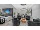 Sophisticated living room with a unique coffee table and comfy seating at 611 Riviera Dunes Way # 702, Palmetto, FL 34221
