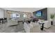 Luxury living room with fireplace and water views at 611 Riviera Dunes Way # 702, Palmetto, FL 34221