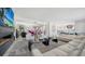 Open living area with a modern fireplace and comfortable seating at 611 Riviera Dunes Way # 702, Palmetto, FL 34221