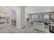 Open concept living area features kitchen, and water views at 611 Riviera Dunes Way # 702, Palmetto, FL 34221