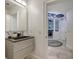 Modern powder room with floating vanity and sleek sink at 611 Riviera Dunes Way # 702, Palmetto, FL 34221