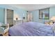 Comfortable bedroom with plush bedding, a window, two dressers, and a closet at 815 Bayport Way # 815, Longboat Key, FL 34228