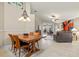 Elegant dining room with a large wooden table and chandelier at 4211 Fairway Pl, North Port, FL 34287