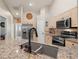 Modern kitchen with granite countertops and stainless steel appliances at 4211 Fairway Pl, North Port, FL 34287