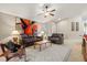 Relaxing living room with leather couches and a ceiling fan at 4211 Fairway Pl, North Port, FL 34287