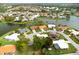 Aerial view of single story home with lake access at 1654 Waxwing Ct, Venice, FL 34293