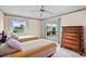 Bedroom with two twin beds and a view of the lake at 1654 Waxwing Ct, Venice, FL 34293