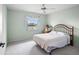 Bright bedroom with a comfortable bed and water view at 1654 Waxwing Ct, Venice, FL 34293