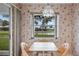 Cozy breakfast nook with a lake view at 1654 Waxwing Ct, Venice, FL 34293