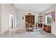 Casual dining area with wooden table and chairs near the kitchen at 1654 Waxwing Ct, Venice, FL 34293