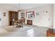 Traditional dining room with a round table, chairs, and a built-in hutch at 1654 Waxwing Ct, Venice, FL 34293