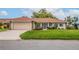 Single-story home with a tile roof and attached garage at 1654 Waxwing Ct, Venice, FL 34293