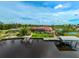 Waterfront property with pink house, dock, and canal at 4409 Crews Ct, Port Charlotte, FL 33952