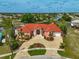 Luxury waterfront home with tile roof and expansive driveway at 4409 Crews Ct, Port Charlotte, FL 33952