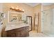 Elegant bathroom with a walk-in shower and modern vanity at 4409 Crews Ct, Port Charlotte, FL 33952