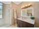 Modern bathroom with vanity, walk-in shower, and large mirror at 4409 Crews Ct, Port Charlotte, FL 33952