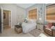 Cozy bedroom with a queen-size bed and sitting area at 4409 Crews Ct, Port Charlotte, FL 33952