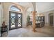 Spacious entryway with decorative columns and access to dining room at 4409 Crews Ct, Port Charlotte, FL 33952