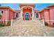 Elegant entryway with grand staircase and Mediterranean architecture at 4409 Crews Ct, Port Charlotte, FL 33952