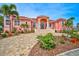 Grand waterfront home with Mediterranean styling and lush landscaping at 4409 Crews Ct, Port Charlotte, FL 33952