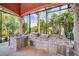 L-Shaped outdoor kitchen with stainless steel appliances and stonework at 4409 Crews Ct, Port Charlotte, FL 33952