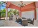 Outdoor kitchen with seating area and ceiling fan at 4409 Crews Ct, Port Charlotte, FL 33952