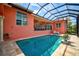 Large refreshing pool with screened enclosure at 4409 Crews Ct, Port Charlotte, FL 33952