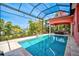 Inviting pool area with a screened enclosure, offering water views at 4409 Crews Ct, Port Charlotte, FL 33952