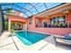 Resort-style pool with screened enclosure and lounge chairs at 4409 Crews Ct, Port Charlotte, FL 33952