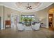 Elegant sitting room with seating area and access to other rooms at 4409 Crews Ct, Port Charlotte, FL 33952