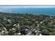 Aerial view showing home's location in a tree-lined neighborhood near the water at 996 Virginia Dr, Sarasota, FL 34234