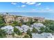 Expansive aerial view of beautiful beachfront properties on a sunny day at 5005 Gulf Of Mexico Dr # 5, Longboat Key, FL 34228