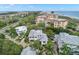 Aerial shot of luxurious homes surrounded by lush greenery near the pristine beach at 5005 Gulf Of Mexico Dr # 5, Longboat Key, FL 34228