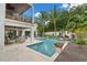 Inviting backyard with pool, patio, and meticulously manicured landscape at 5005 Gulf Of Mexico Dr # 5, Longboat Key, FL 34228