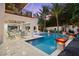 A luxurious outdoor space with a pool and spa at 5005 Gulf Of Mexico Dr # 5, Longboat Key, FL 34228