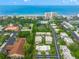 Aerial view showcasing property and surrounding area at 542 Sutton Pl, Longboat Key, FL 34228