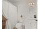 Bathroom with shower/tub combo, white vanity, and toilet at 542 Sutton Pl, Longboat Key, FL 34228