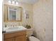 Clean bathroom with white vanity, toilet and shower at 542 Sutton Pl, Longboat Key, FL 34228