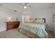 Spacious bedroom with carpeted floors and ceiling fan at 542 Sutton Pl, Longboat Key, FL 34228