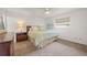 Bright bedroom with a queen-size bed and dresser at 542 Sutton Pl, Longboat Key, FL 34228