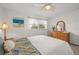 Charming bedroom with wicker furniture and ceiling fan at 542 Sutton Pl, Longboat Key, FL 34228